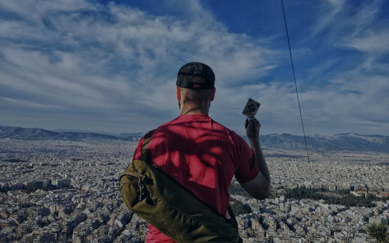 Person consulting a map above a city landscape